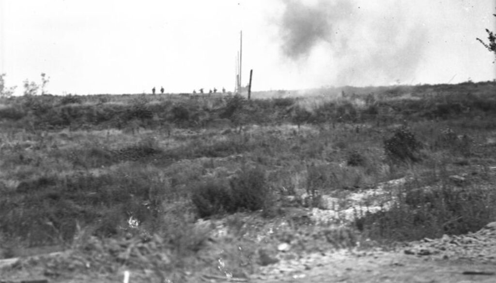 73_Canadians advancing in the distance. Shell bursting in foreground. Advance East of Arras. August, 1918
